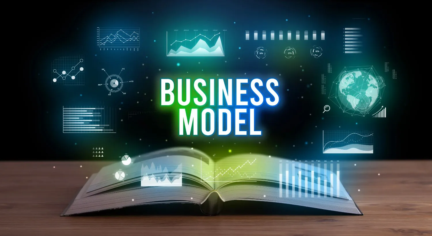 An open book on a table with digital business graphs, charts, and icons emerging, highlighting the words “Business Model” in bold letters above the book.. canadianghostwriters