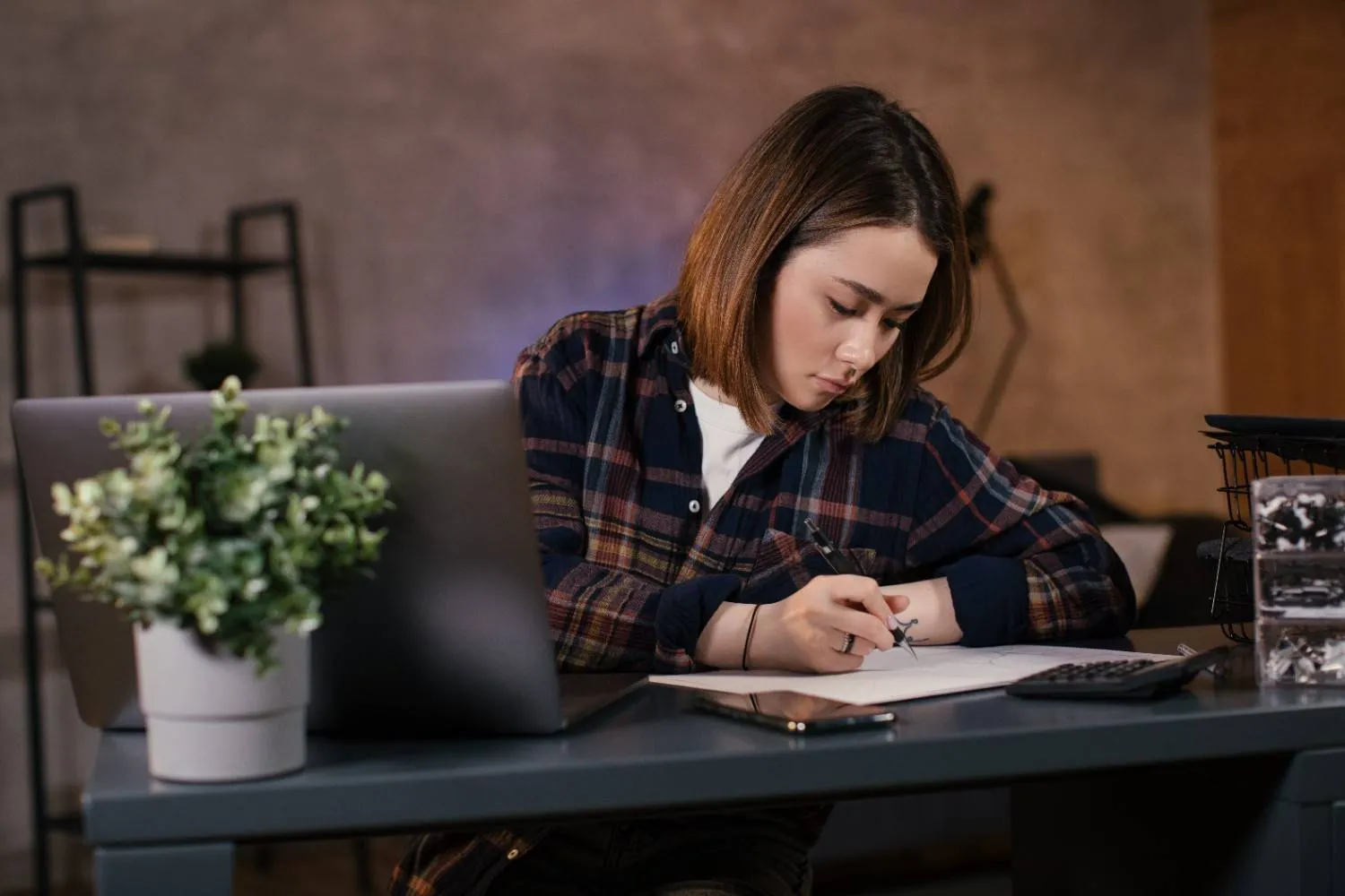 asian-girl-trader-working-laptop-home canadianghostwriters