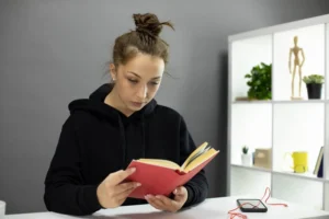 beautiful-student-sitting-home-reads-educational-literature-self-isolation canadianghostwriters