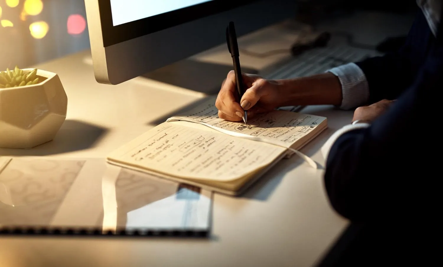 hands-writing-notebook-working-night-creative-ideas-strategy-schedule-desk-closeup-entrepreneur-woman-with-pen-notes-planning-information-goals-project canadianghostwriters