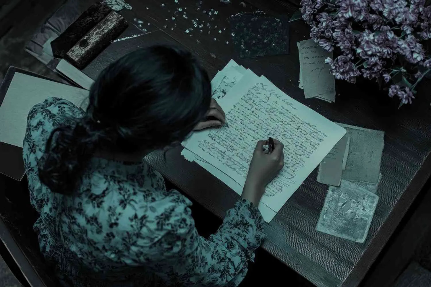 woman-writing-letter-desk-with-flowers-old-photos Canadian ghostwriters