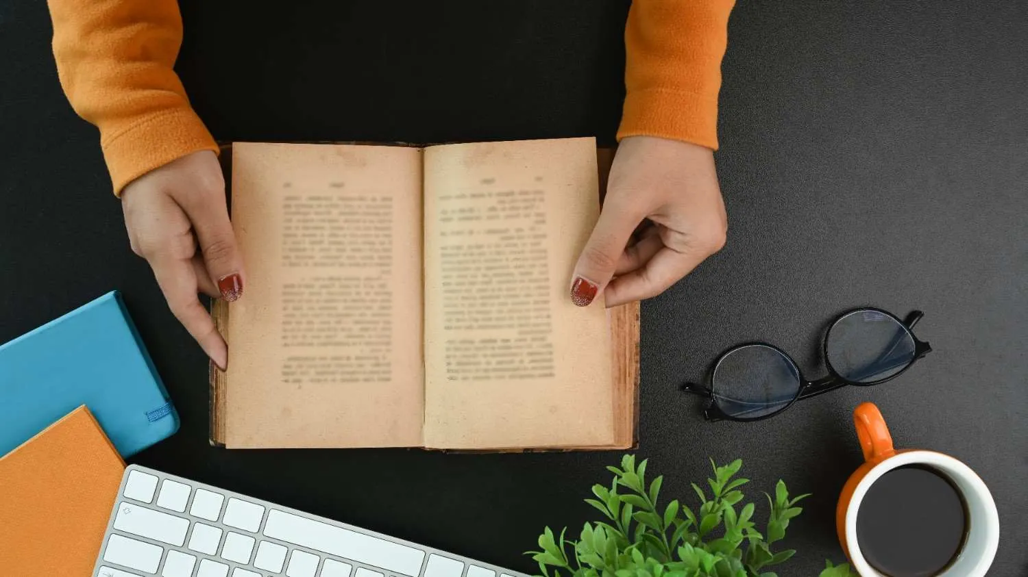 view-female-college-student-reading-book-black-table canadianghostwriters